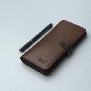Brown leather wallet with a pen